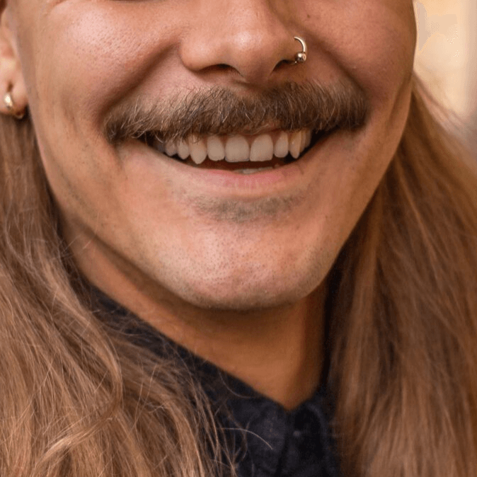 Close up of man with moustache smiling